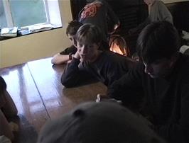 Card games and fireside chats at Tyncornel youth hostel before bedtme
